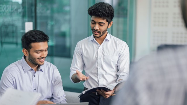 Two people discussing work